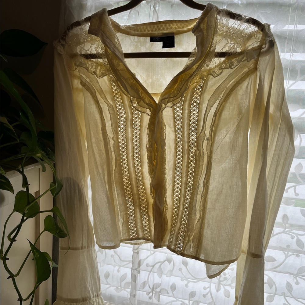 Cream Cropped Blouse with Bib Collar and Long Sleeves